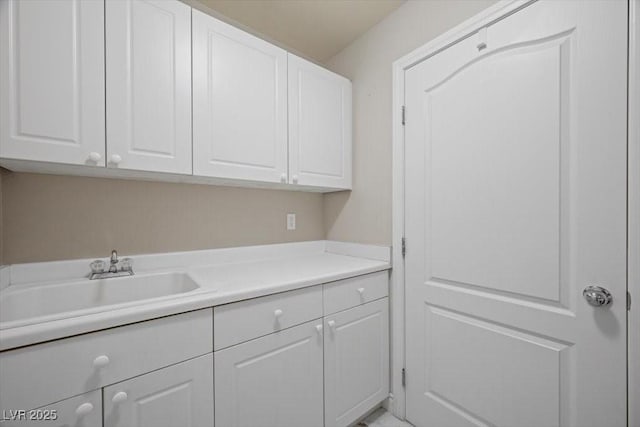 7012 Geese Gathering St, North Las Vegas, NV 89084 - laundry room featuring a sink