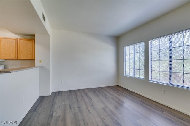 2030 Rancho Lake Dr Unit 201, Las Vegas, NV 89108 - unfurnished living room with wood finished floors and baseboards