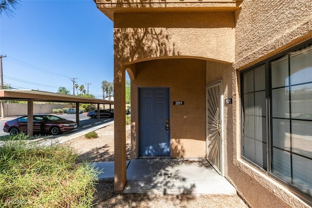 2030 Rancho Lake Dr Unit 201, Las Vegas, NV 89108 - property entrance with stucco siding and covered parking