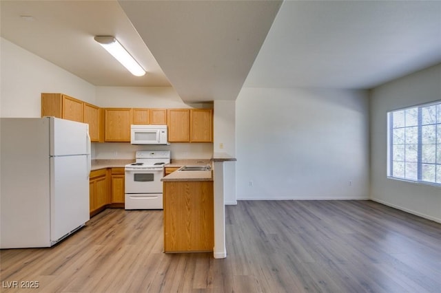 2030 Rancho Lake Dr Unit 201, Las Vegas, NV 89108 - kitchen with white appliances, light wood-style floors, light countertops, and open floor plan