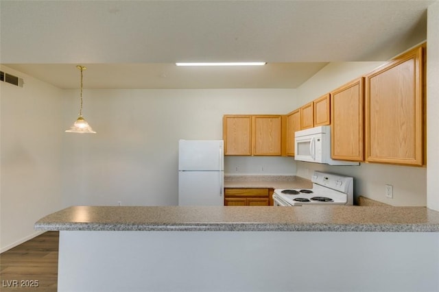 2030 Rancho Lake Dr Unit 201, Las Vegas, NV 89108 - kitchen with white appliances, a peninsula, dark wood finished floors, hanging light fixtures, and light countertops
