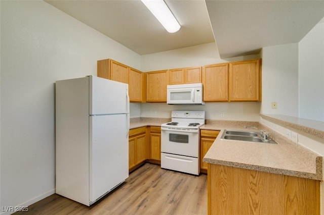 2030 Rancho Lake Dr Unit 201, Las Vegas, NV 89108 - kitchen featuring white appliances, light wood finished floors, light countertops, a peninsula, and light brown cabinetry