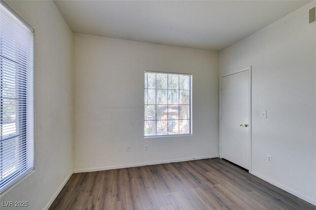 2030 Rancho Lake Dr Unit 201, Las Vegas, NV 89108 - unfurnished room featuring dark wood-style floors and baseboards