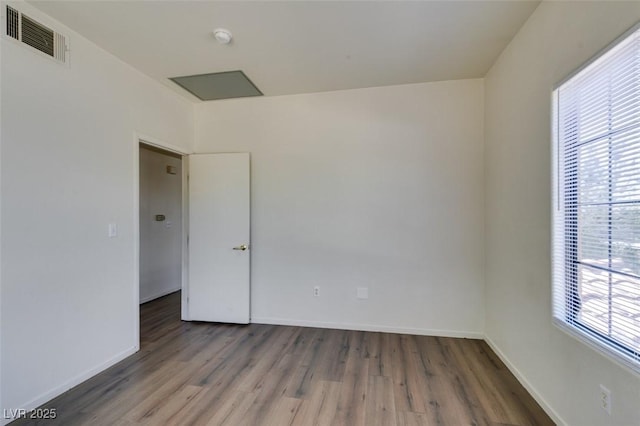 2030 Rancho Lake Dr Unit 201, Las Vegas, NV 89108 - unfurnished room with wood finished floors and a smoke detector