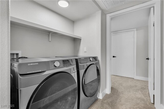 5710 E Tropicana Ave Unit 2152, Las Vegas, NV 89122 - washroom with washer and clothes dryer and light carpet