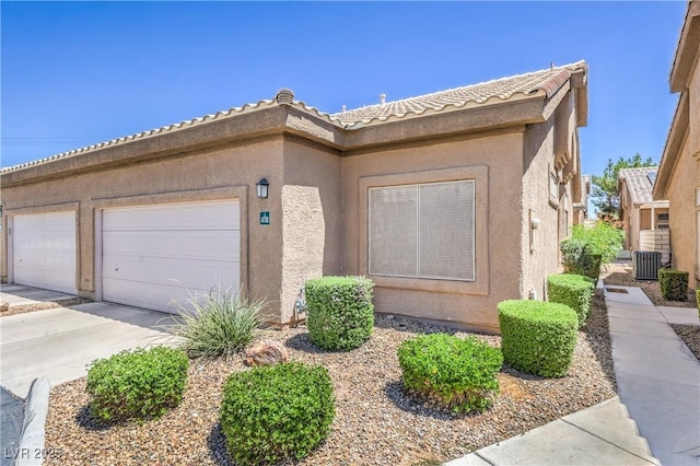 4770 Big Draw Dr, North Las Vegas, NV 89031 - view of front facade with concrete driveway, stucco siding, and a garage
