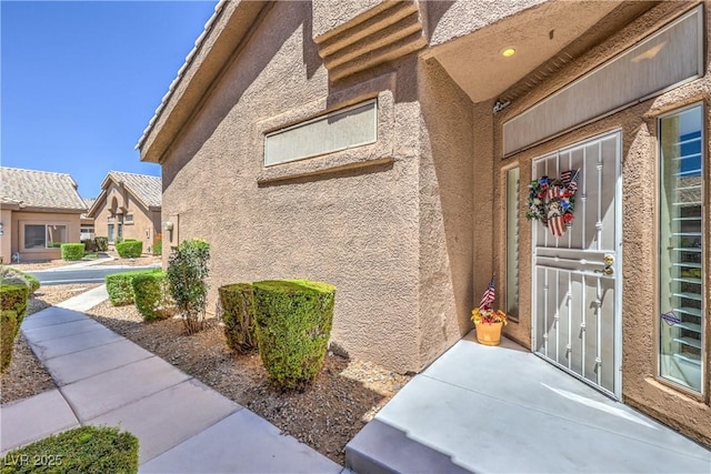 4770 Big Draw Dr, North Las Vegas, NV 89031 - view of exterior entry featuring stucco siding