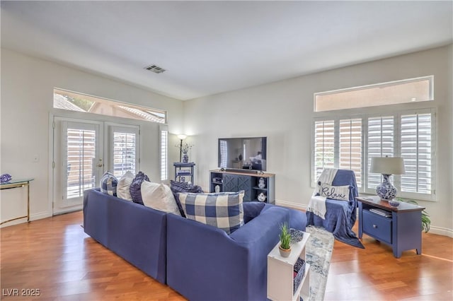 4770 Big Draw Dr, North Las Vegas, NV 89031 - living area featuring wood finished floors and plenty of natural light