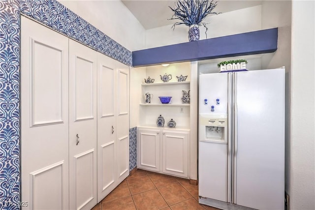 4770 Big Draw Dr, North Las Vegas, NV 89031 - kitchen featuring white fridge with ice dispenser, tile patterned flooring, and white cabinets