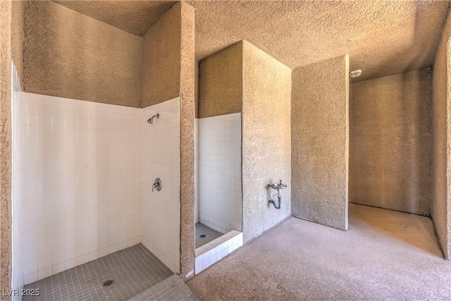 4770 Big Draw Dr, North Las Vegas, NV 89031 - bathroom with a tile shower and a textured ceiling