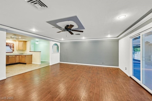 1885 Valley Dr, Las Vegas, NV 89108 - unfurnished living room featuring a ceiling fan, hardwood / wood-style flooring, crown molding, and recessed lighting