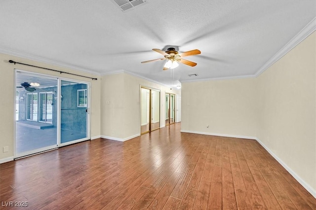 1885 Valley Dr, Las Vegas, NV 89108 - spare room with a ceiling fan, wood finished floors, and crown molding