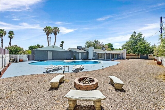 1885 Valley Dr, Las Vegas, NV 89108 - community pool with a fire pit, a fenced backyard, and a patio