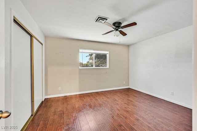 1885 Valley Dr, Las Vegas, NV 89108 - unfurnished bedroom with wood-type flooring, a closet, and a ceiling fan