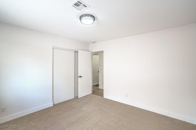 10009 Coral Sands Dr, Las Vegas, NV 89117 - unfurnished bedroom featuring light colored carpet and a closet