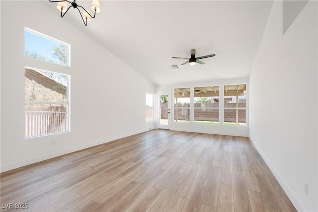 3622 Covewick Dr, North Las Vegas, NV 89032 - unfurnished living room with a chandelier, healthy amount of natural light, light wood-style floors, and ceiling fan