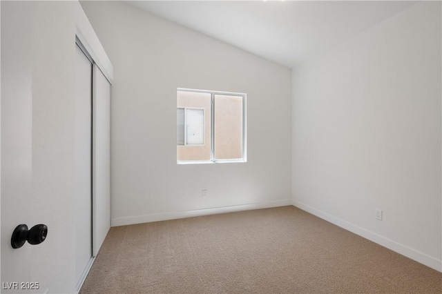3622 Covewick Dr, North Las Vegas, NV 89032 - unfurnished bedroom with carpet, a closet, and vaulted ceiling