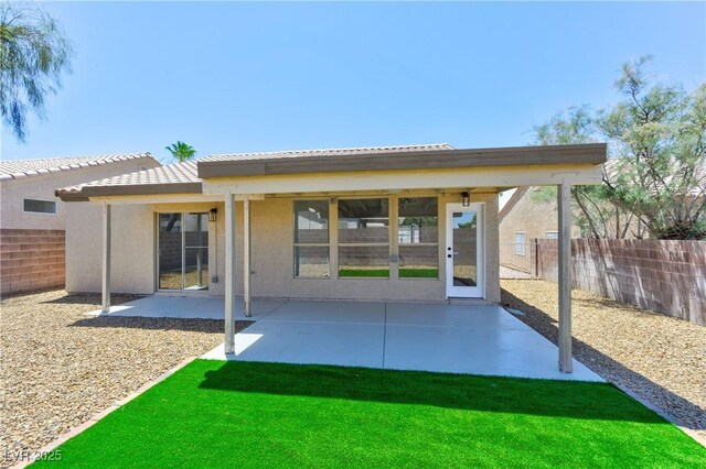 3622 Covewick Dr, North Las Vegas, NV 89032 - rear view of house with a fenced backyard and a patio area