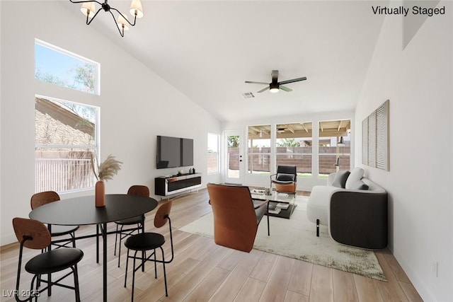 3622 Covewick Dr, North Las Vegas, NV 89032 - living room featuring wood finished floors, a chandelier, a ceiling fan, and high vaulted ceiling
