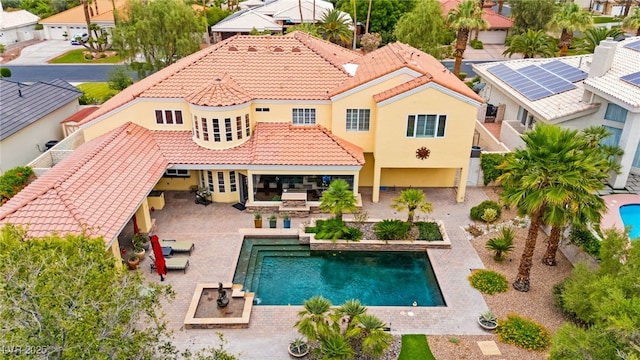 7428 Doe Ave, Las Vegas, NV 89117 - back of property with a tile roof, stucco siding, a residential view, and outdoor dining area