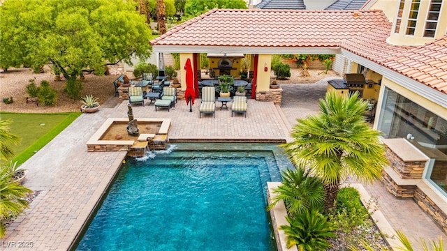 7428 Doe Ave, Las Vegas, NV 89117 - outdoor pool with exterior kitchen and a patio area