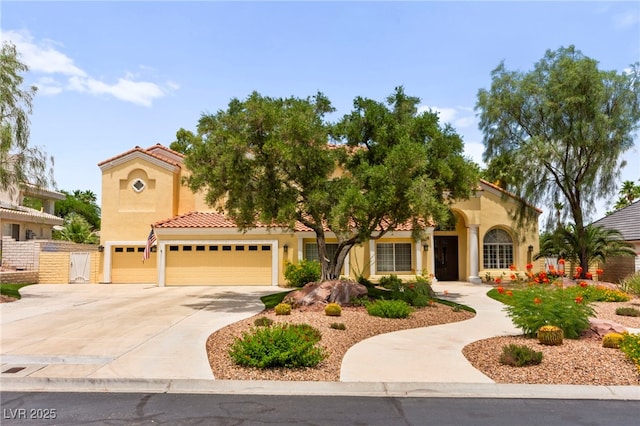 7428 Doe Ave, Las Vegas, NV 89117 - mediterranean / spanish-style house featuring driveway, stucco siding, a tiled roof, and an attached garage
