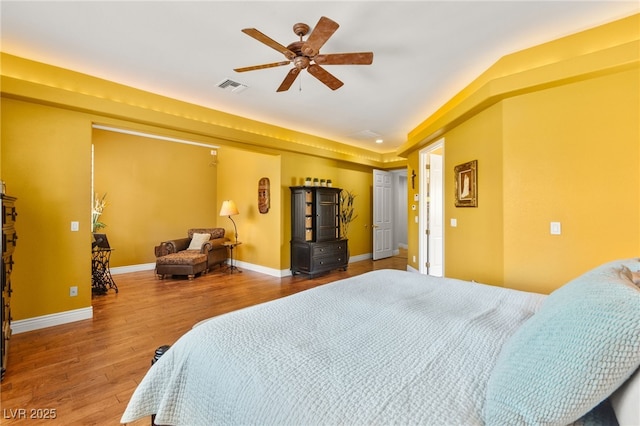 7428 Doe Ave, Las Vegas, NV 89117 - bedroom with wood finished floors and ceiling fan