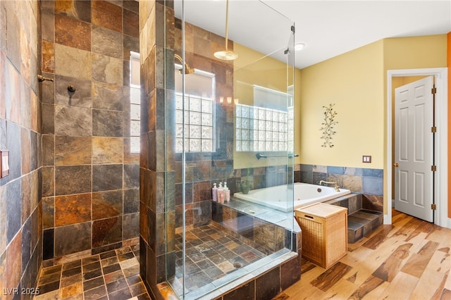 7428 Doe Ave, Las Vegas, NV 89117 - full bath with a garden tub, a stall shower, and wood finished floors