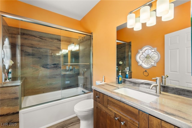 7428 Doe Ave, Las Vegas, NV 89117 - full bath with vanity, shower / bath combination with glass door, and wood finished floors