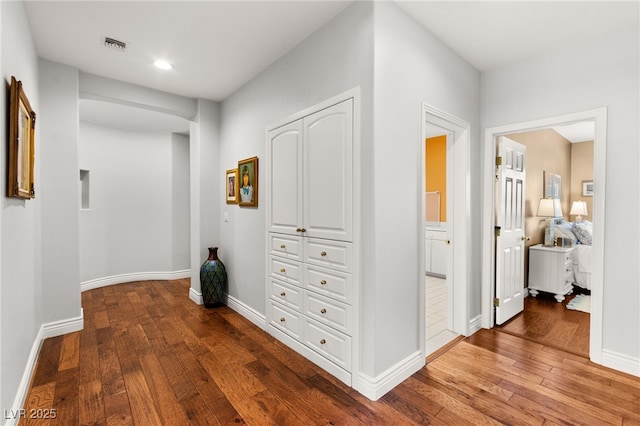 7428 Doe Ave, Las Vegas, NV 89117 - hallway featuring wood-type flooring and recessed lighting