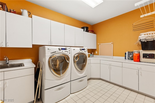 7428 Doe Ave, Las Vegas, NV 89117 - washroom featuring separate washer and dryer, cabinet space, and light tile patterned flooring