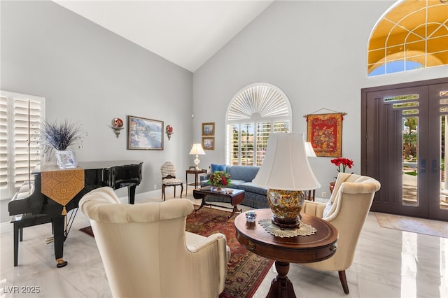 7428 Doe Ave, Las Vegas, NV 89117 - living room featuring high vaulted ceiling and french doors