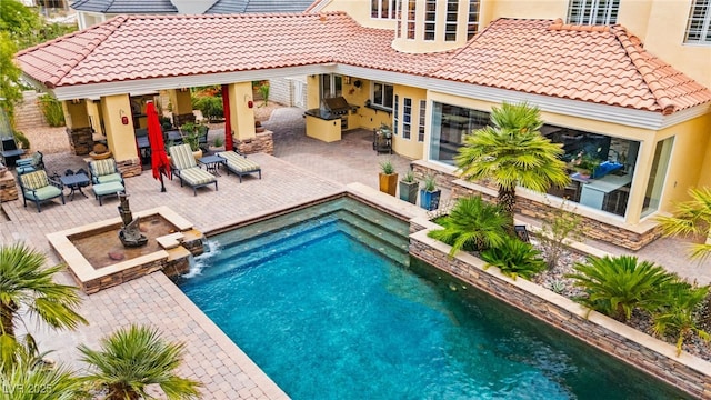 7428 Doe Ave, Las Vegas, NV 89117 - swimming pool with an outdoor kitchen and a patio