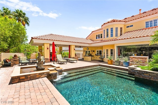 7428 Doe Ave, Las Vegas, NV 89117 - view of swimming pool featuring a patio area and exterior kitchen
