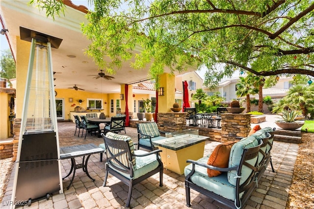 7428 Doe Ave, Las Vegas, NV 89117 - view of patio with an outdoor living space with a fire pit and a ceiling fan