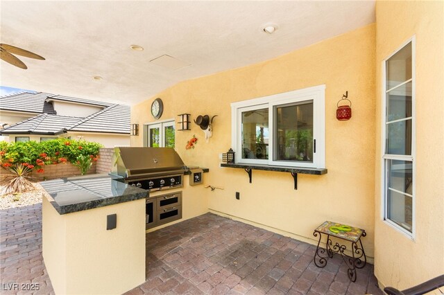 7428 Doe Ave, Las Vegas, NV 89117 - view of patio featuring exterior kitchen and a ceiling fan