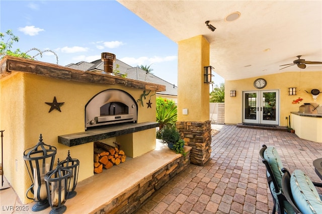 7428 Doe Ave, Las Vegas, NV 89117 - view of patio / terrace with an outdoor kitchen, french doors, and a ceiling fan