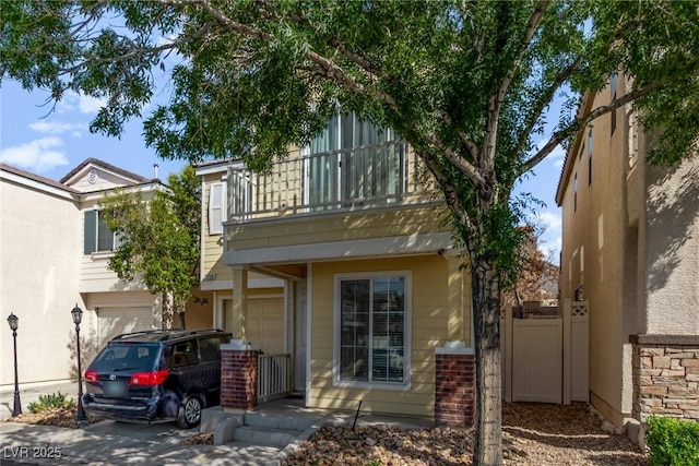 1739 Spanish Sky Ave, Las Vegas, NV 89183 - rear view of property featuring a balcony and an attached garage