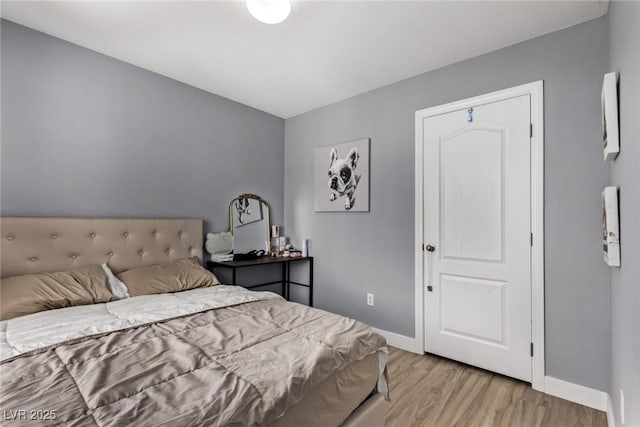 1739 Spanish Sky Ave, Las Vegas, NV 89183 - bedroom with light wood-style flooring and baseboards