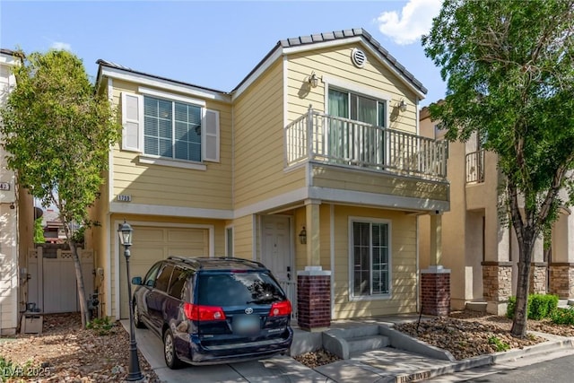 1739 Spanish Sky Ave, Las Vegas, NV 89183 - view of property with a balcony, a garage, and driveway