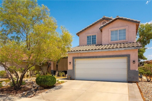 3650 Russian Olive St, North Las Vegas, NV 89032 - view of front of property featuring an attached garage, stucco siding, and driveway