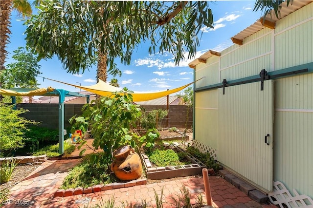 3650 Russian Olive St, North Las Vegas, NV 89032 - fenced backyard featuring a garden