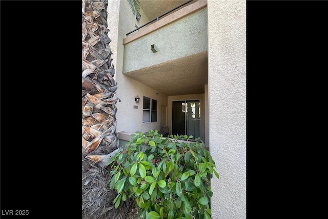 7155 S Durango Dr Unit 102, Las Vegas, NV 89113 - view of exterior entry featuring stucco siding