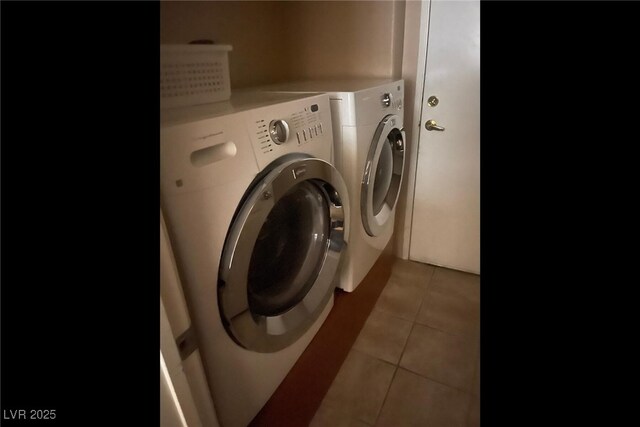 7155 S Durango Dr Unit 102, Las Vegas, NV 89113 - laundry room featuring separate washer and dryer and light tile patterned floors