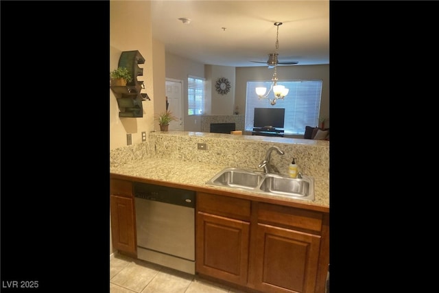 7155 S Durango Dr Unit 102, Las Vegas, NV 89113 - kitchen featuring stainless steel dishwasher, light tile patterned floors, a ceiling fan, a fireplace, and hanging light fixtures