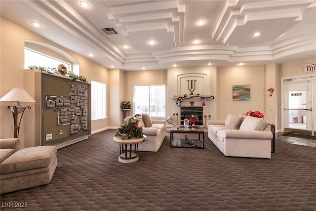 7155 S Durango Dr Unit 102, Las Vegas, NV 89113 - living room with dark colored carpet, a fireplace, and recessed lighting