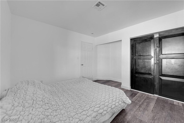 6129 Bedrock Ct, North Las Vegas, NV 89031 - bedroom with dark wood-type flooring and baseboards