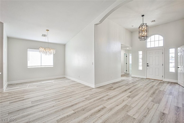 1002 Christopher View Ave, North Las Vegas, NV 89032 - foyer with a chandelier, light wood-style flooring, and healthy amount of natural light