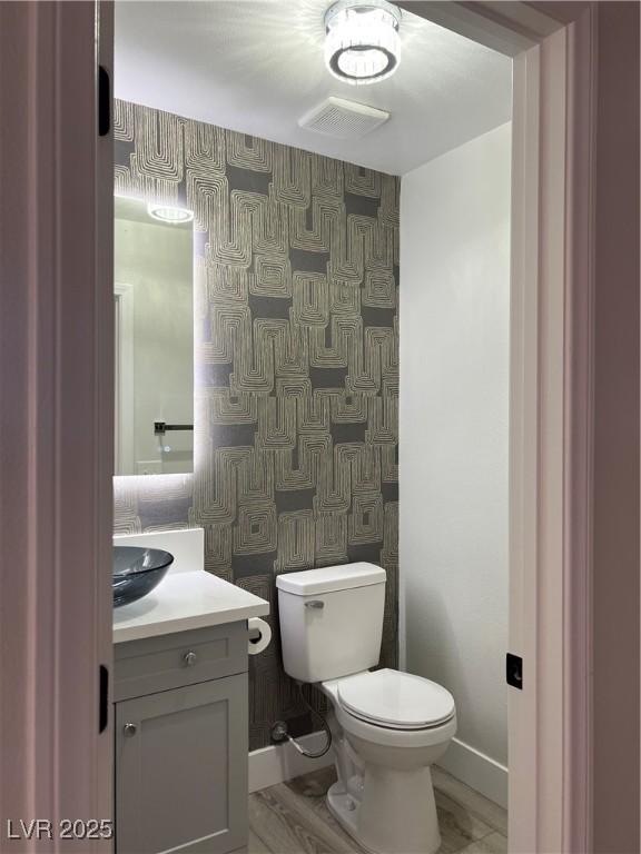 1002 Christopher View Ave, North Las Vegas, NV 89032 - bathroom with wallpapered walls and vanity