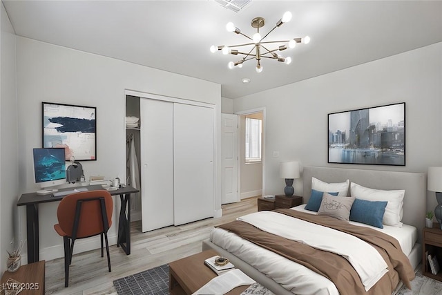 1002 Christopher View Ave, North Las Vegas, NV 89032 - bedroom featuring a closet, light wood finished floors, a desk, and a chandelier